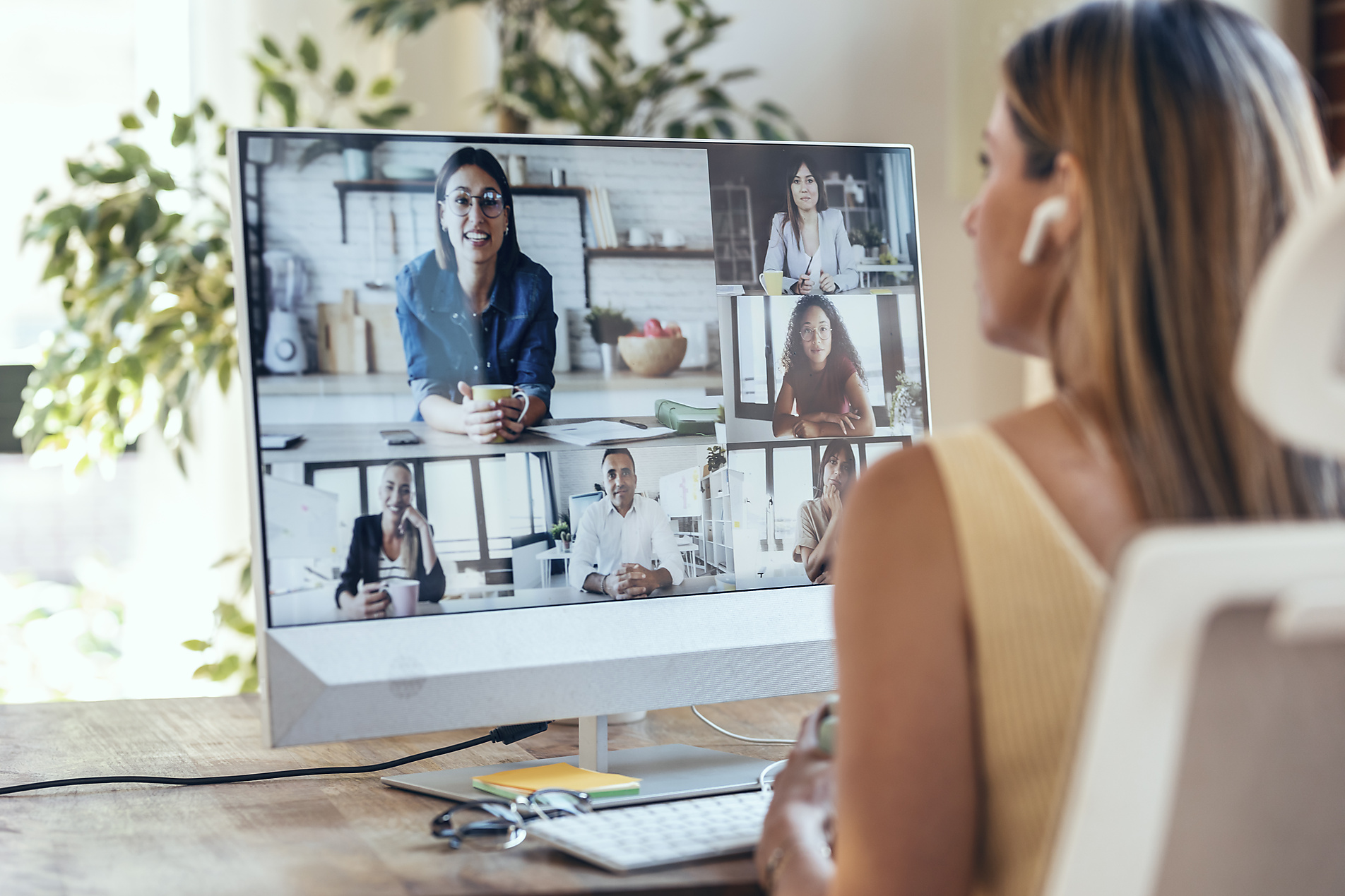 New Work, Stock image, royalty-free, Businesswoman discussing during video conference through computer at home