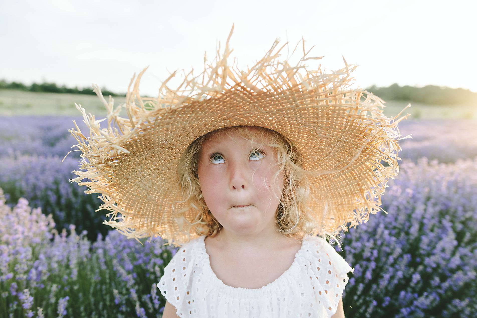 stock photo, royalty-free, Girl wearing hat making face in lavender field