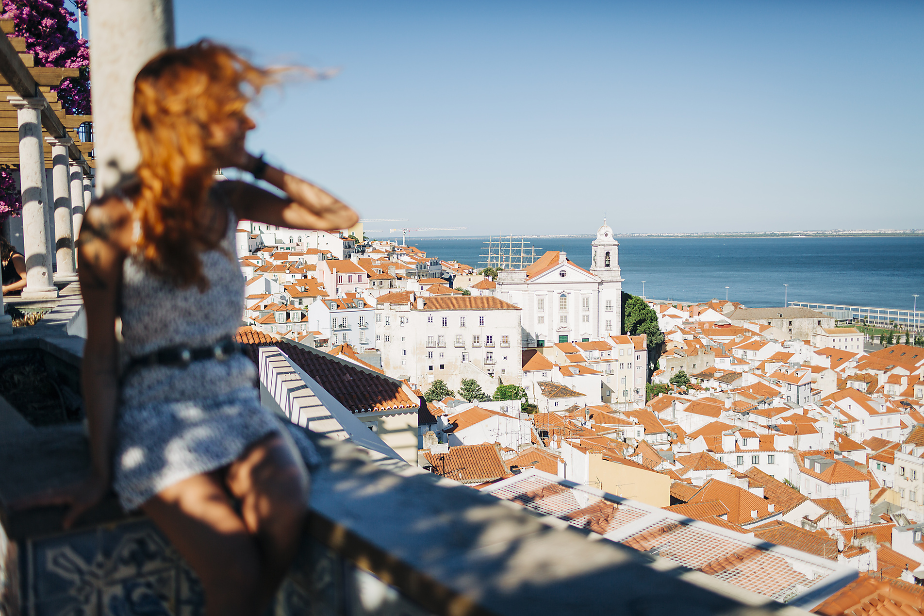 Stock image, royalty-free, Woman admiring the view of old town Alfama, Lisbon, Portugal