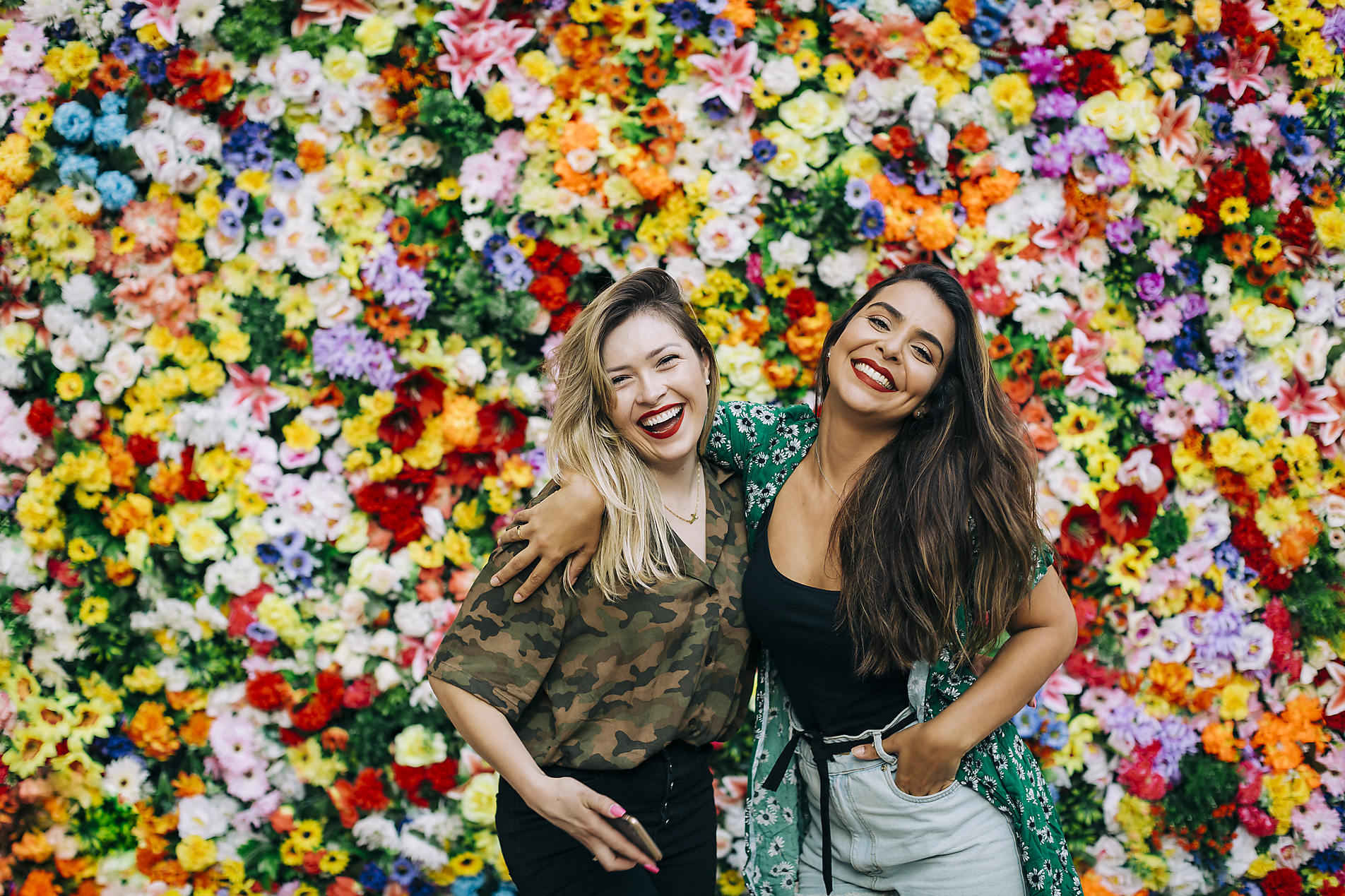 stock image, royalty-free, Cheerful beautiful female friends standing against colorful flowers, Portugal, Alexandra C Ribeiro