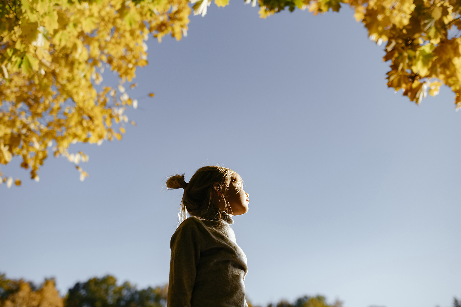 Stock image, royalty-free, Little girl enjoying sunlight in autumn, Ekaterina Yakunina