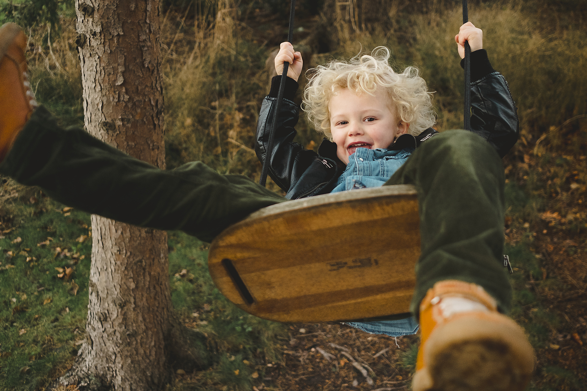 stock image, royalty-free, happy blonde boy sitting on a swing in autumn, Johner Images