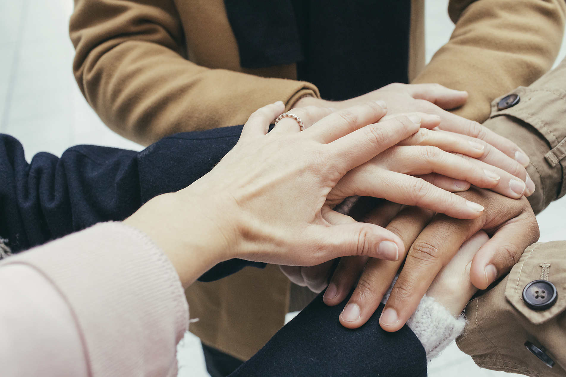 Stock image, royalty-free, Group of friends putting hands together, Katharina Mikhrin, Westend61