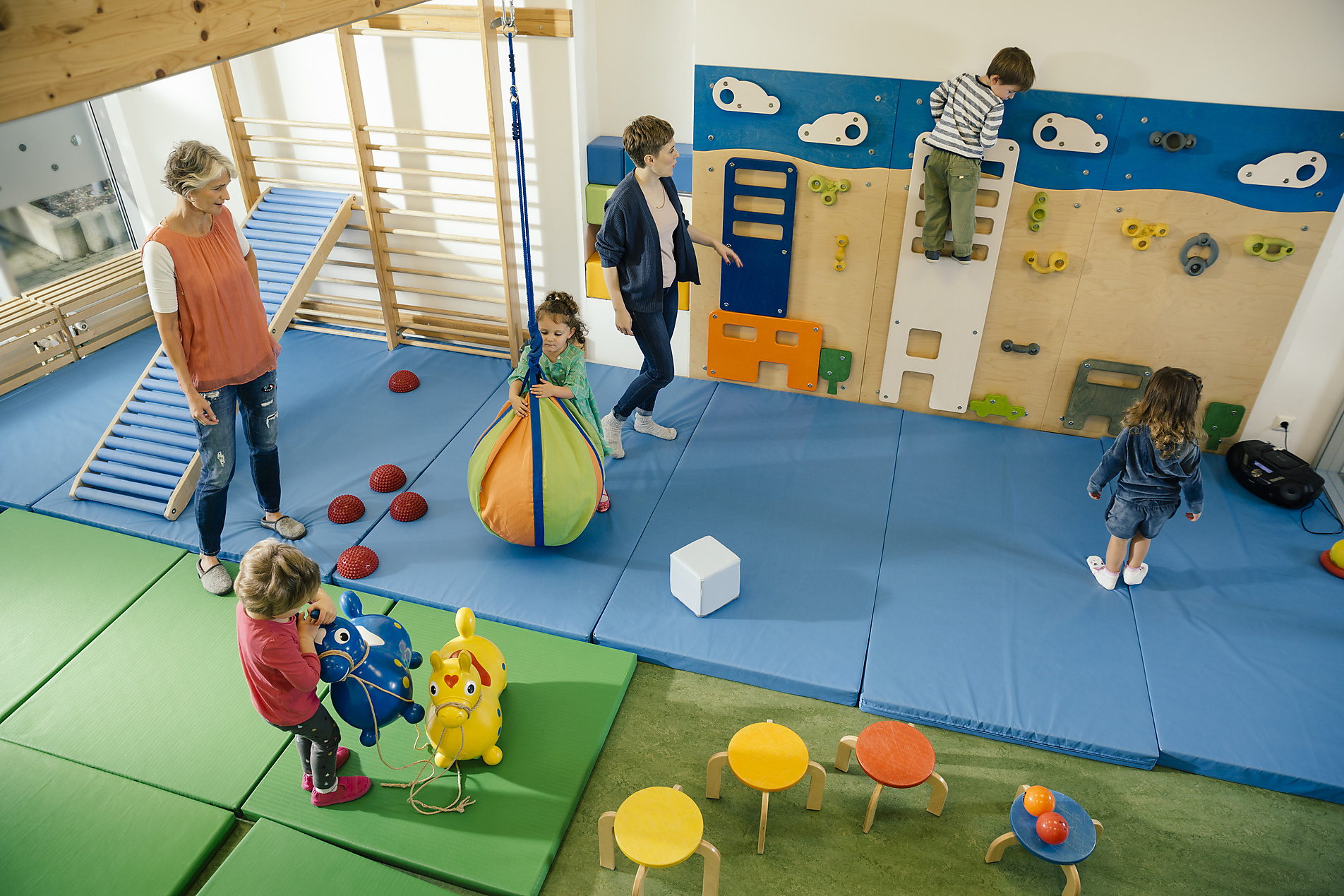 stock image, royalty-free, Pre-school teachers and children in gym room in kindergarten, Mareen Fischinger, Westend61, education, future