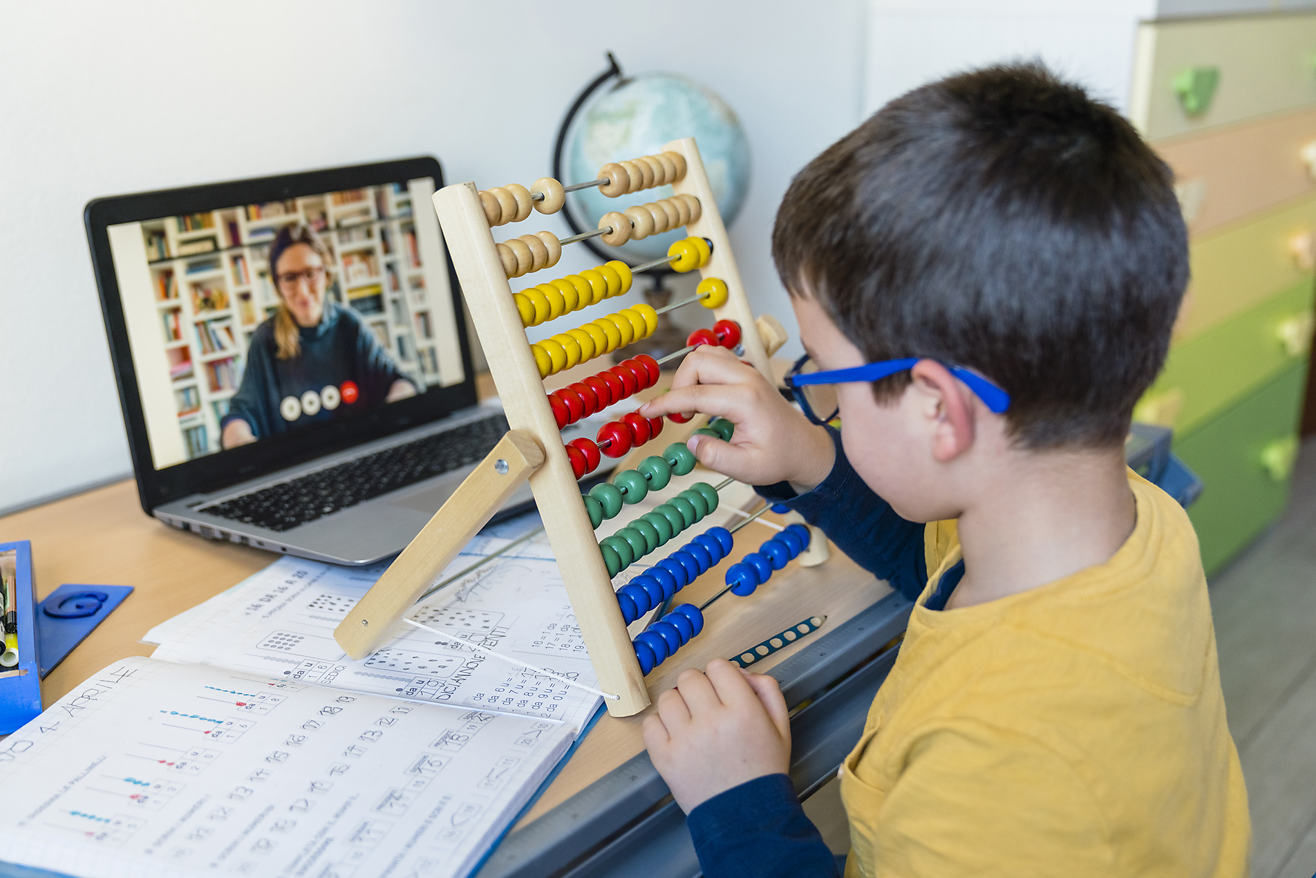 stock image, royalty-free, Male student with abacus at desk while teacher on video call during COVID-19 homeschooling, westend61, Giorgio Magini, Education, Future, School