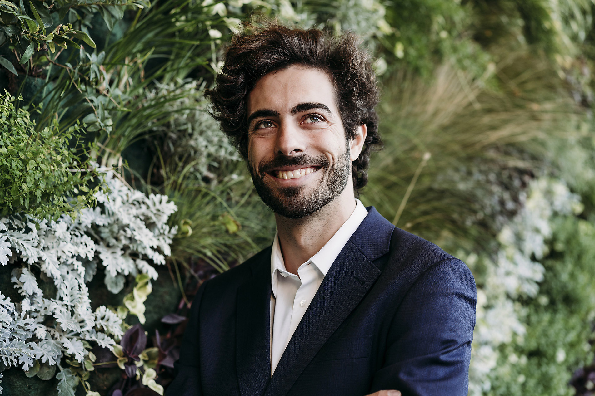 Happy businessman day dreaming near plants, Vision, imagination, action optimism, stock photo, royalty free, trends 2023, visual trends