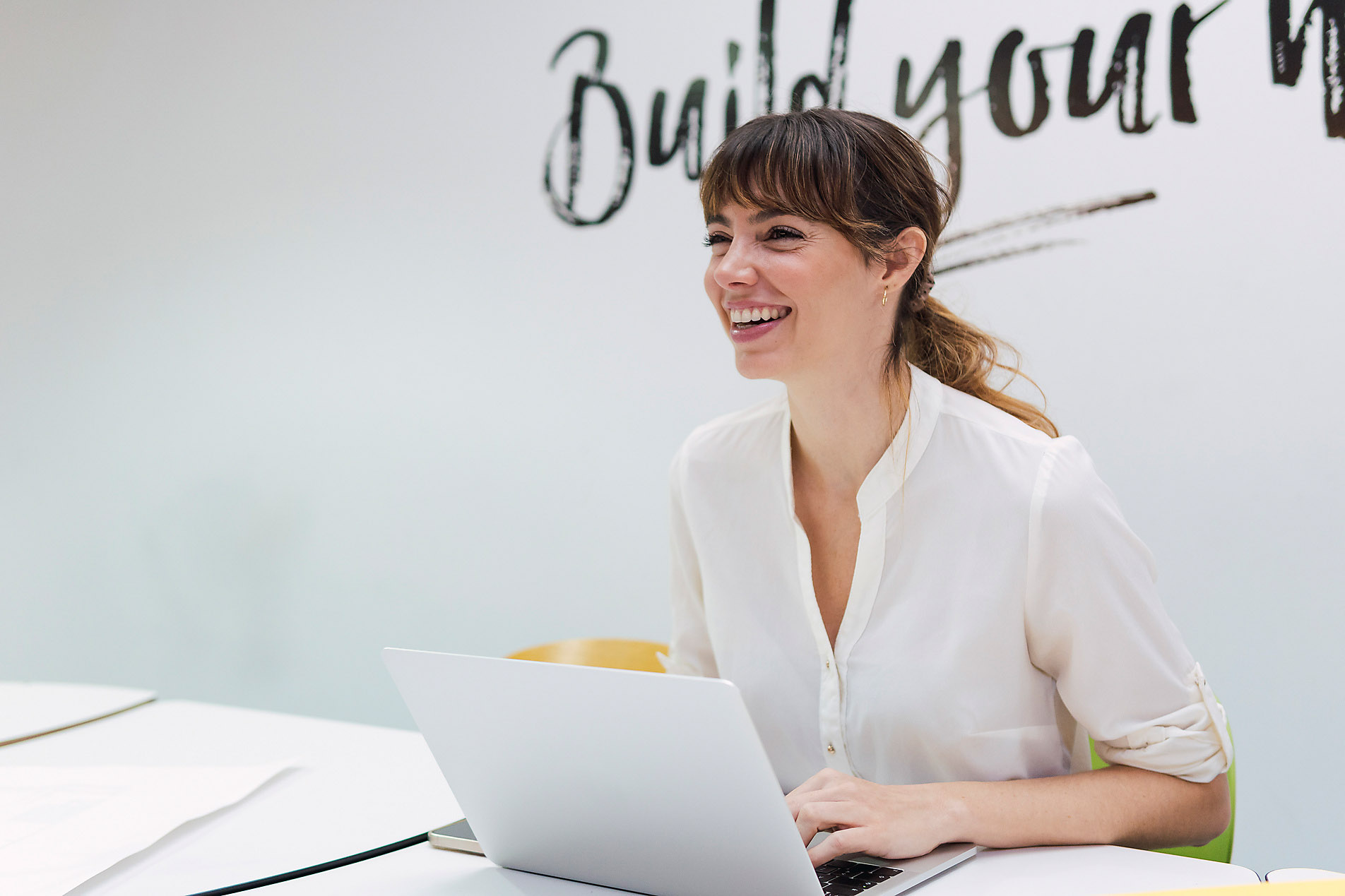 Happy business woman with laptop in office, stock photo, royalty free, sustainability, new work, office space