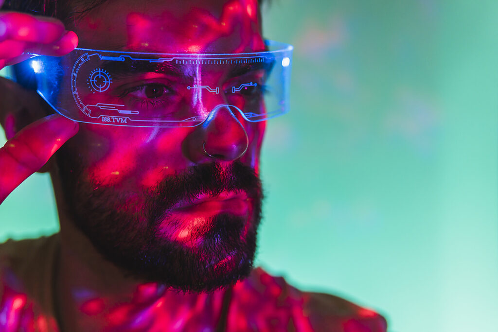 Man with beard wearing futuristic smart glasses, stock image, royalty-free, westend61, metaverse