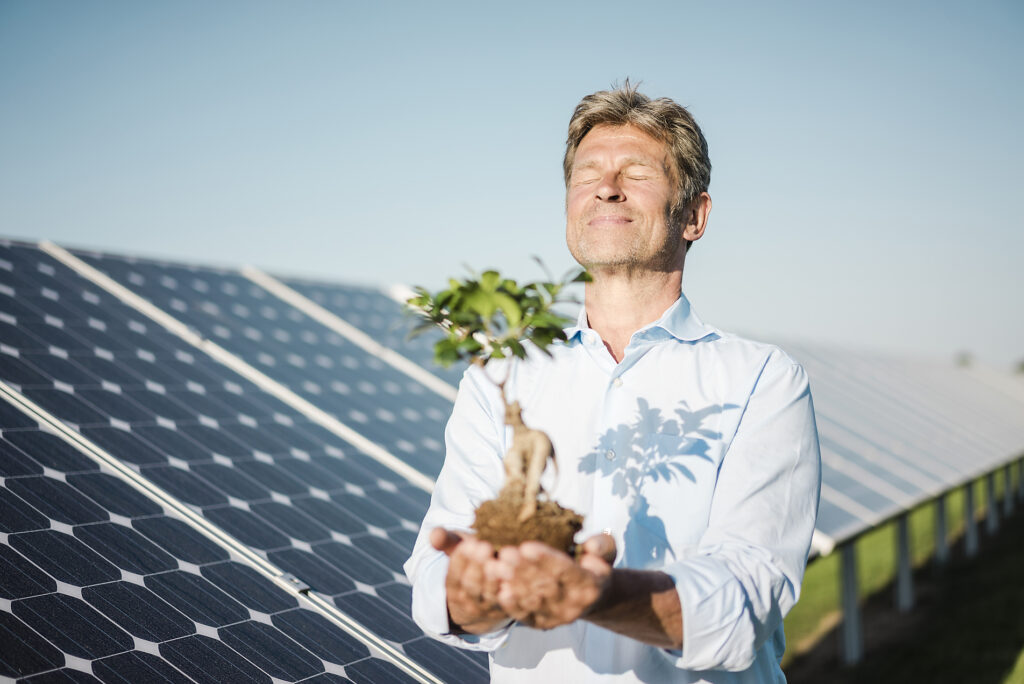 Stock Image, Royalty Free, Mature man looking at privet, solar plant
