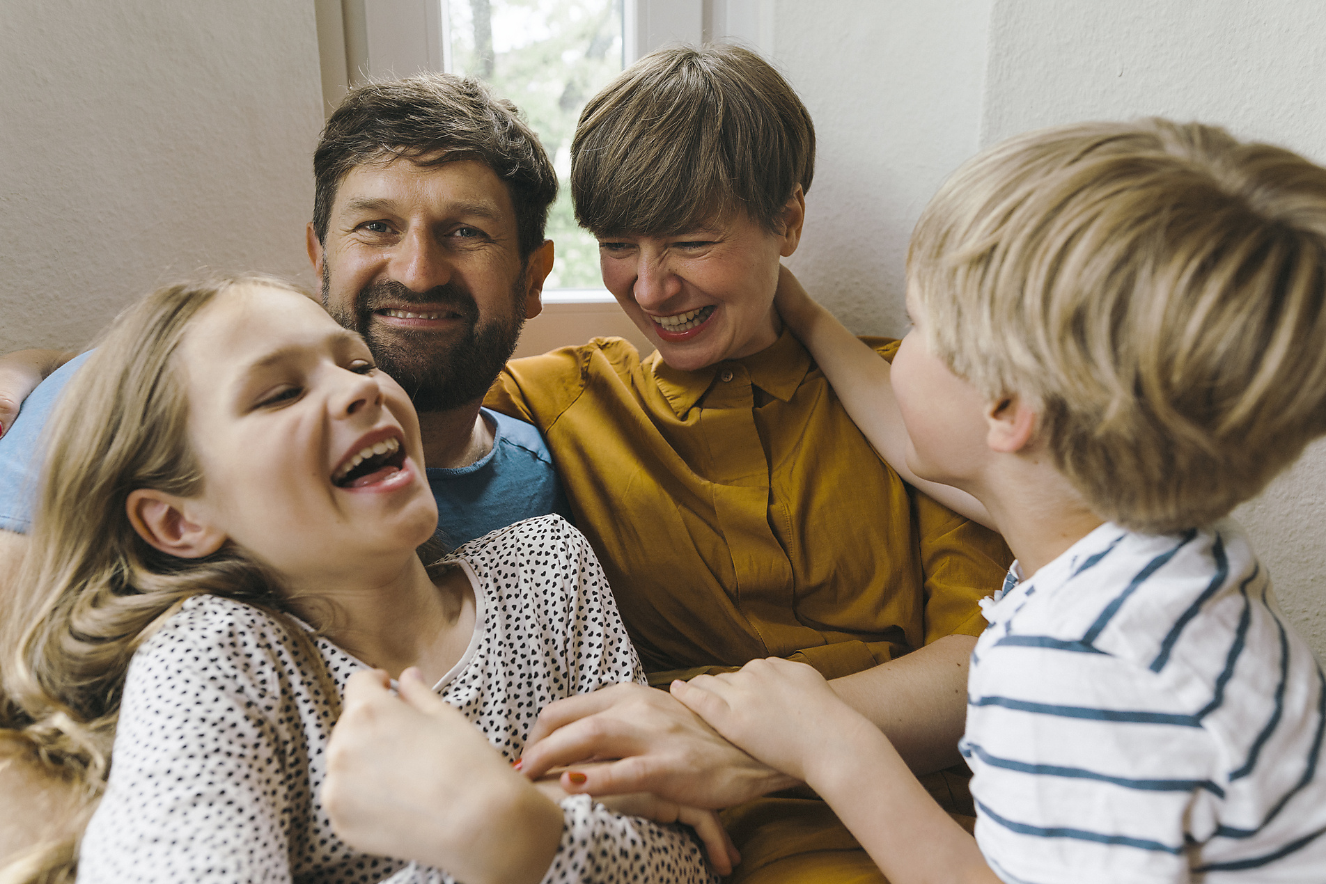 Royalty Free Stockimage of cheerful woman having fun with family at home