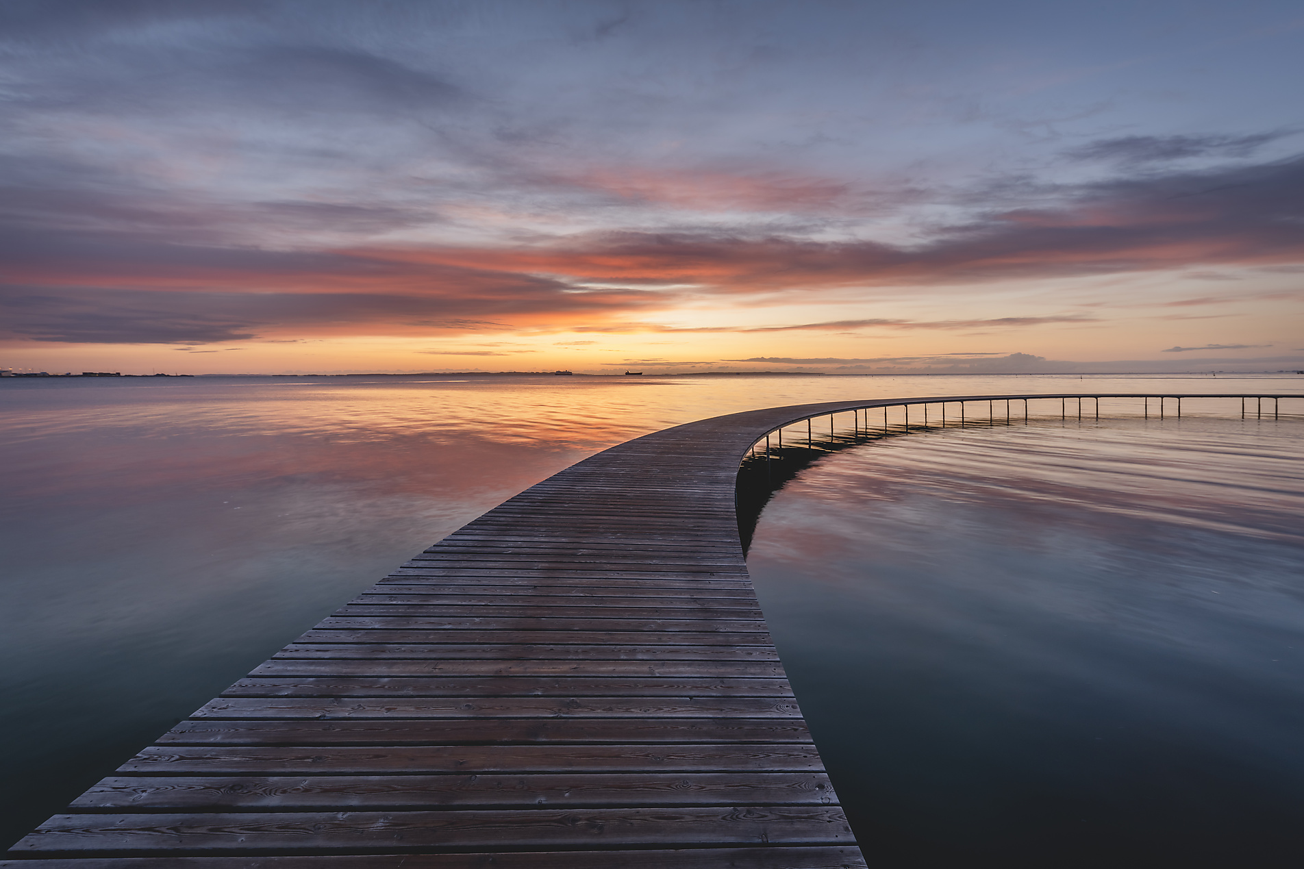 Stockphoto, Royalty Free Stock Image, Denmark, Aarhus, Long exposure of Infinite Bridge and Aarhus Bay at sunrise