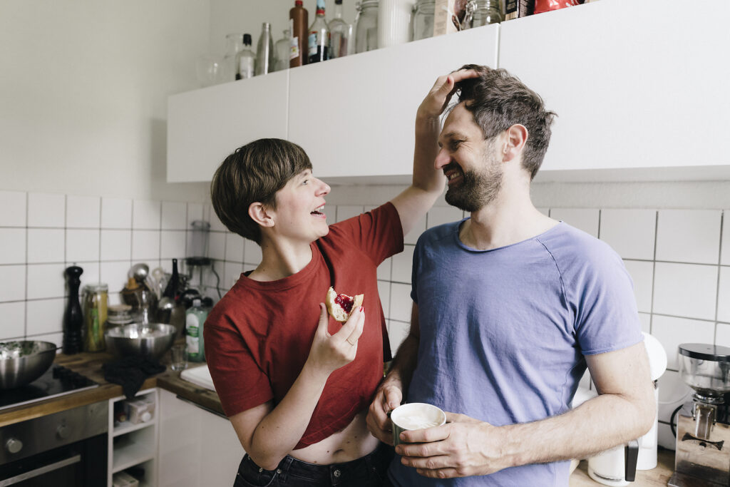 Woman caressing hair of man standing in kitchen at home
Royalty free image