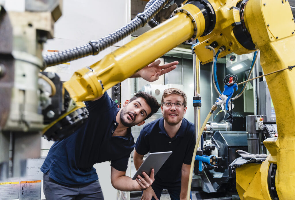 Male coworkers examining robotic arm in manufacturing industry Royalty free image Male coworkers examining robotic arm in manufacturing industry
Royalty free image