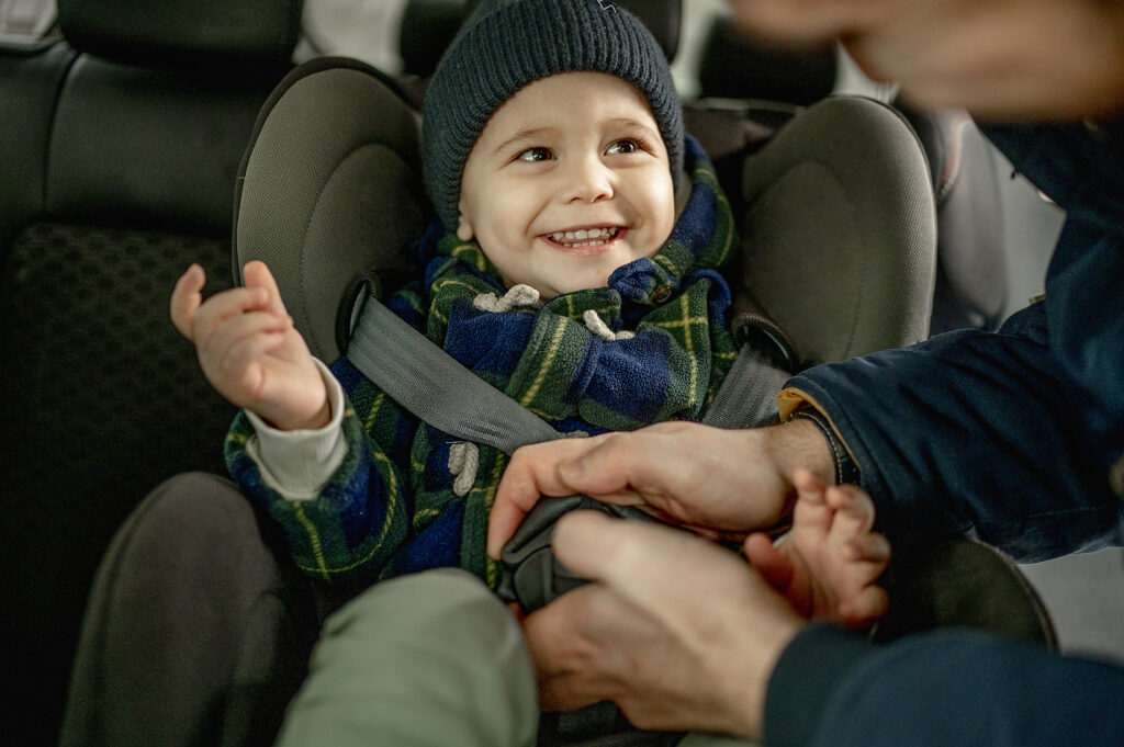 Father fastening car seat belt for happy boy
Royalty free image