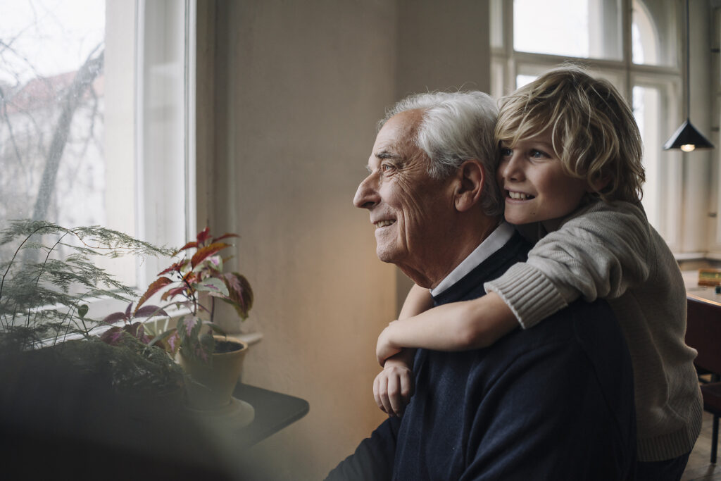 Happy grandson embracing grandfather at home
Royalty free image