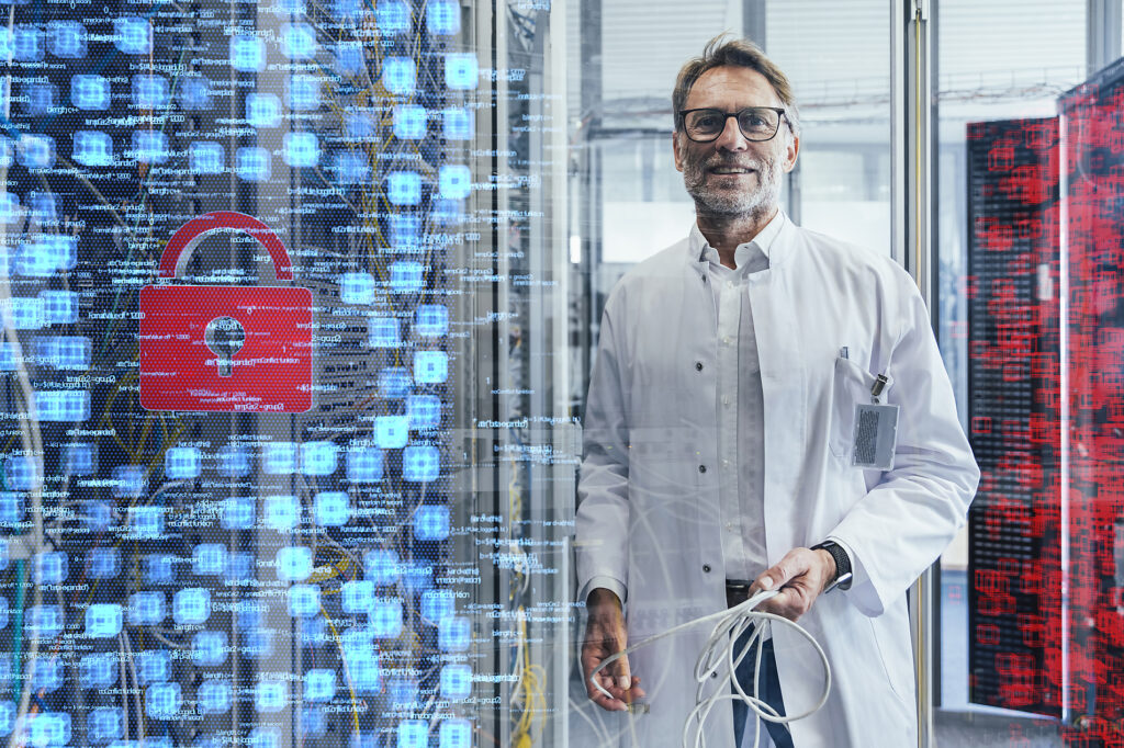 Male technician holding cable at data center
Royalty free image