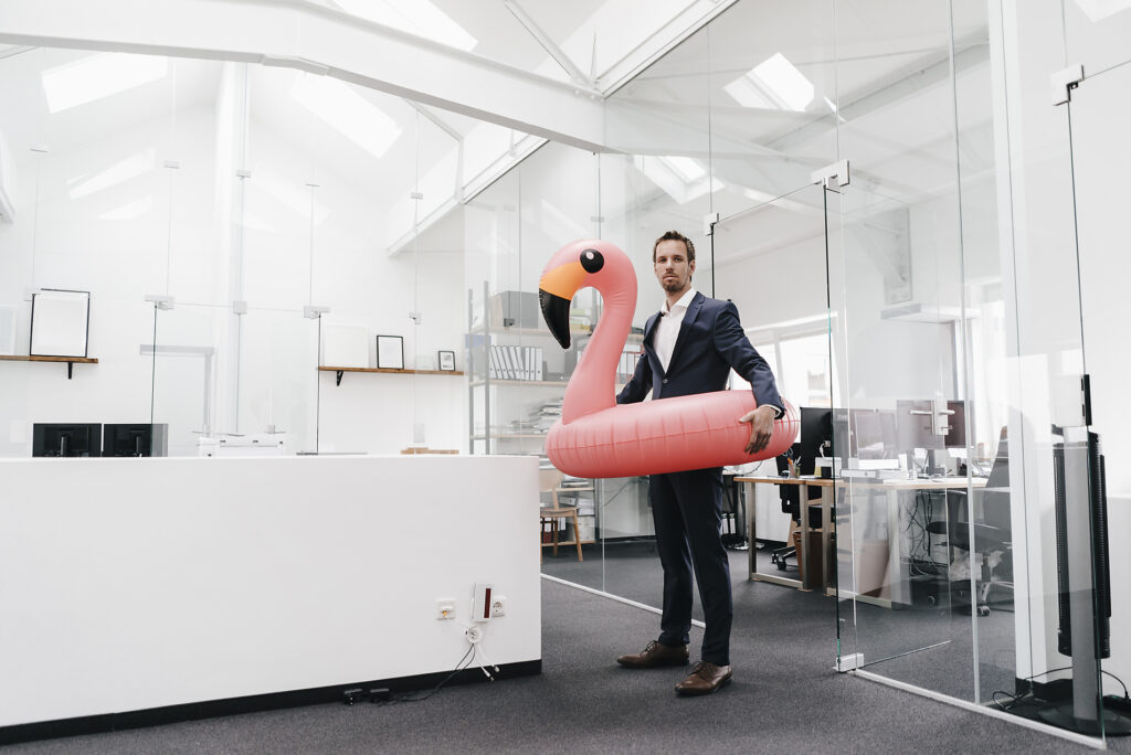 Businessman in office with inflatable flamingo
Royalty-free image
