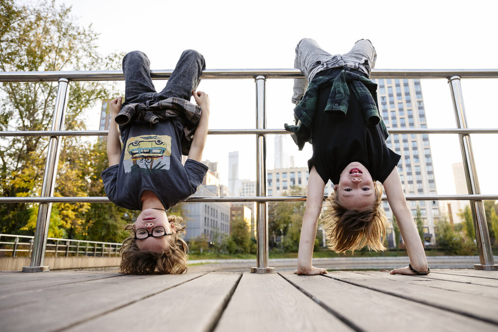 Children hanging upside down from railing
Royalty-free image