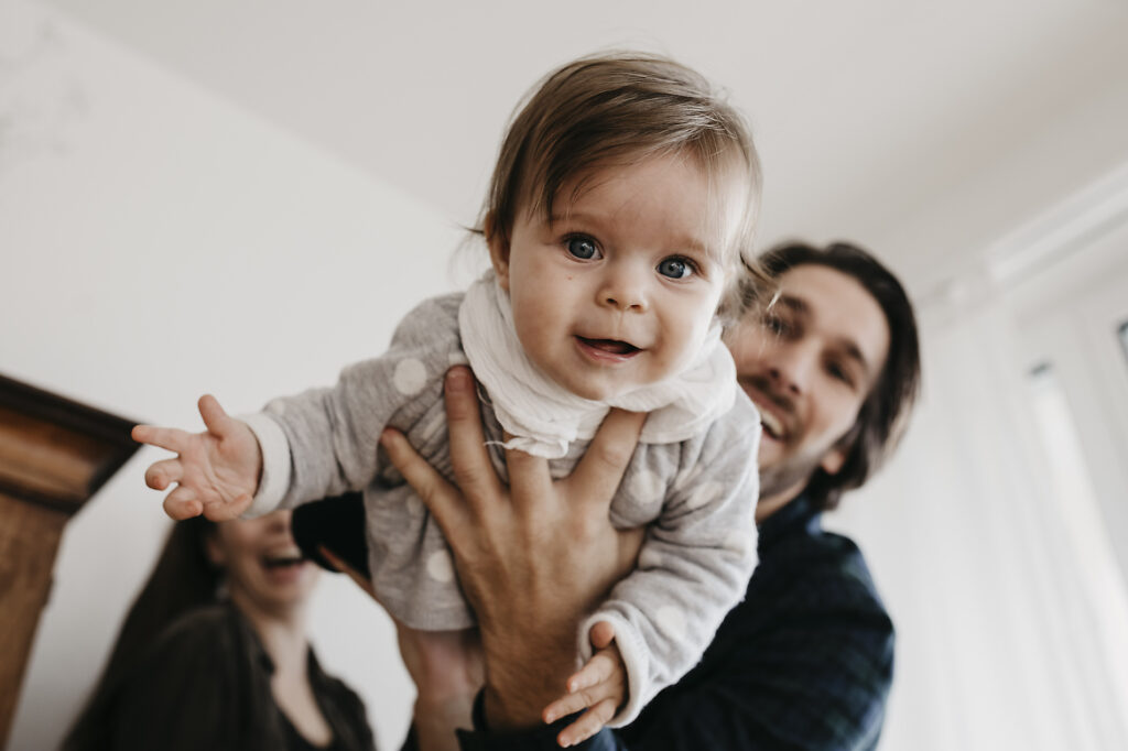 Happy family playing with baby girl at home
Royalty-free image