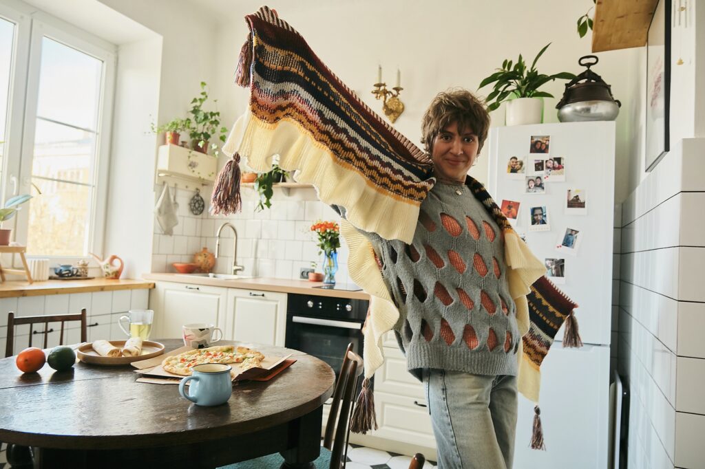 Smiling person in cozy kitchen in the morning enjoying breakfast
Royalty-free image