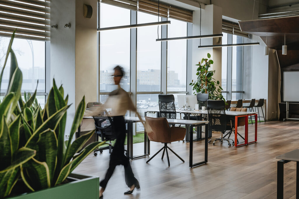 Businesswoman walking through modern office interior with motion blur Royalty-free image Businesswoman walking through modern office interior with motion blurRoyalty-free image