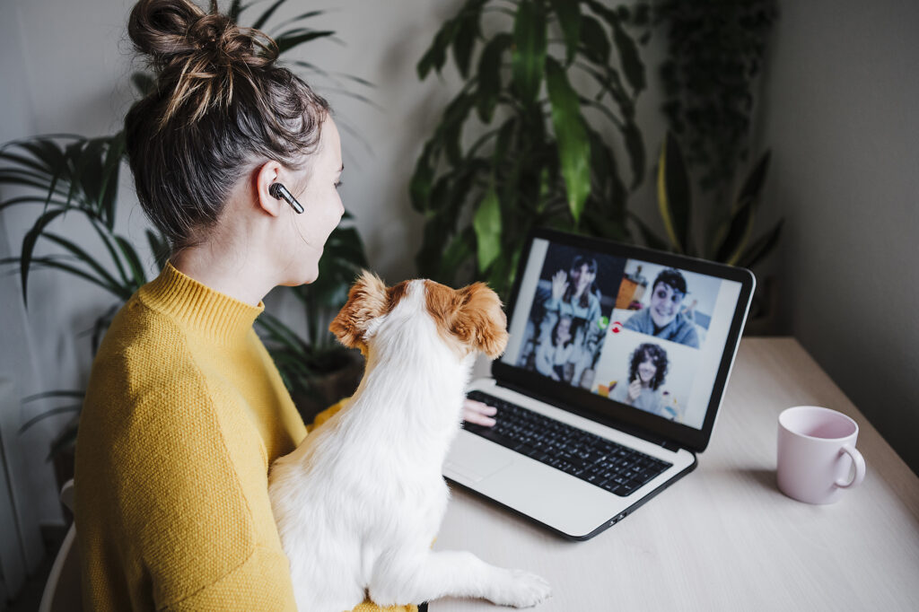 Woman talking with friends on video conference over digital tablet while sitting with pet at home
Royalty-free image