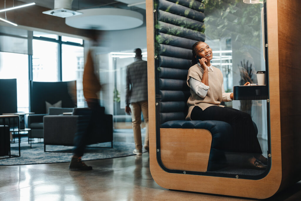 Happy businesswoman sitting in a coworking space, speaking on her smartphone, discussing a business call. Smiling and successful, showcasing her communication and remote working skills.
Royalty-free image
