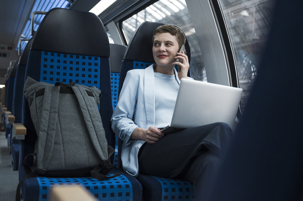 Businesswoman working with laptop and talking on mobile in train compartment Royalty-free image Businesswoman working with laptop and talking on mobile in train compartment
Royalty-free image