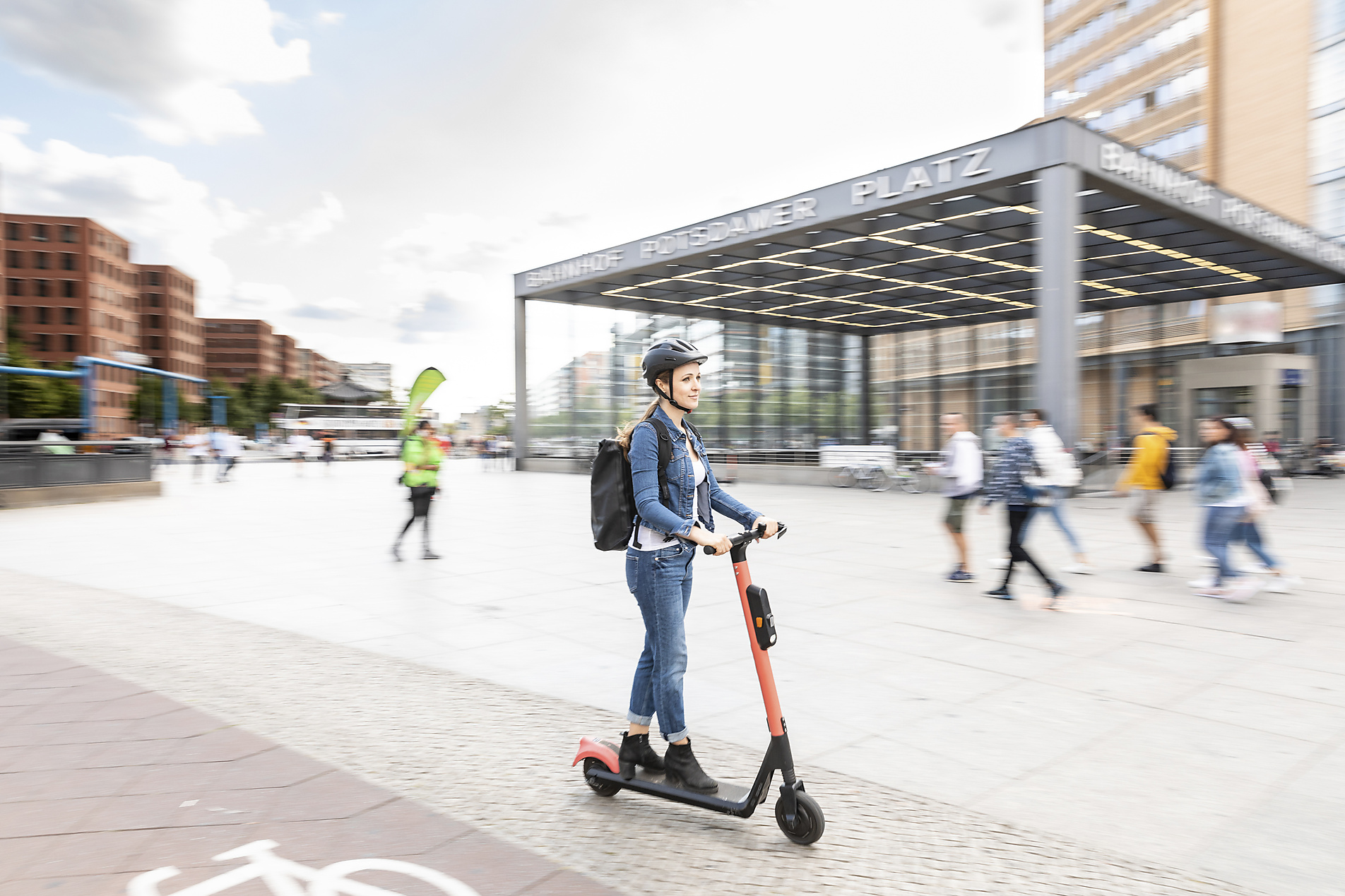 Woman riding e-scooter in the city, Berlin, Germany, Berlin, Germany Royalty-free image Woman riding e-scooter in the city, Berlin, Germany, Berlin, Germany
Royalty-free image