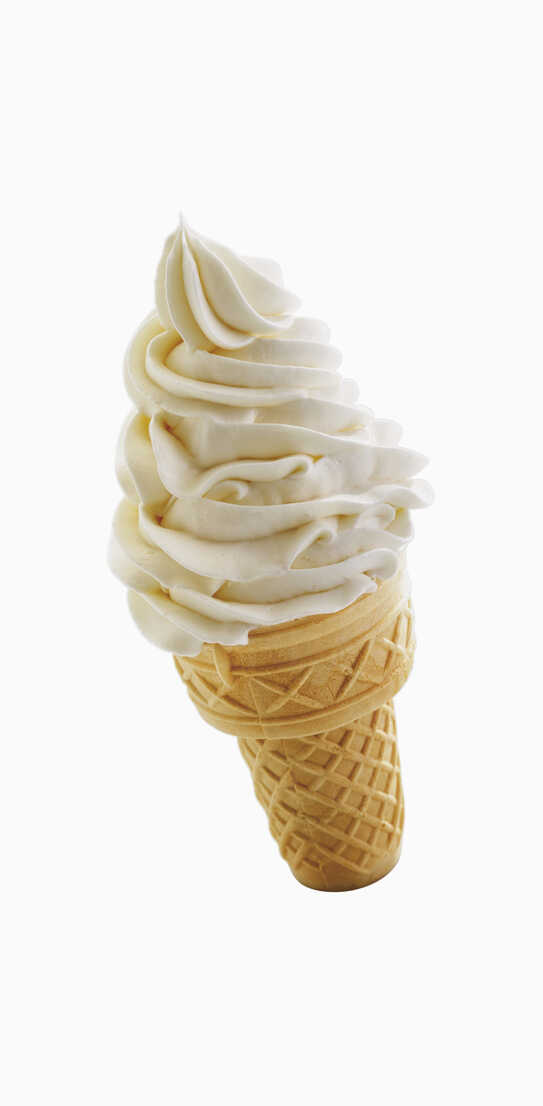 Vanilla ice cream cone against white background stock photo