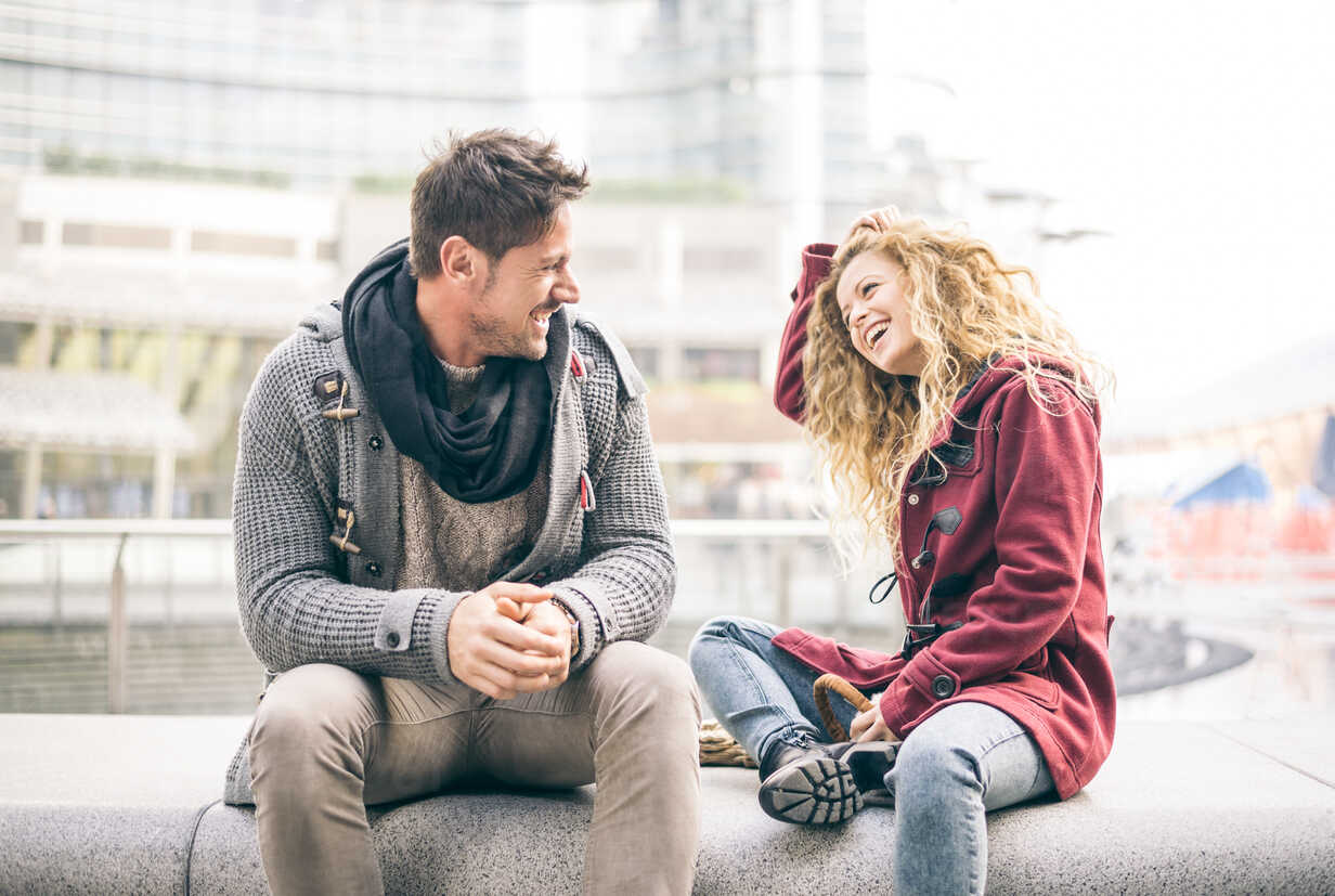 Italy, Milan, couple laughing together stock photo