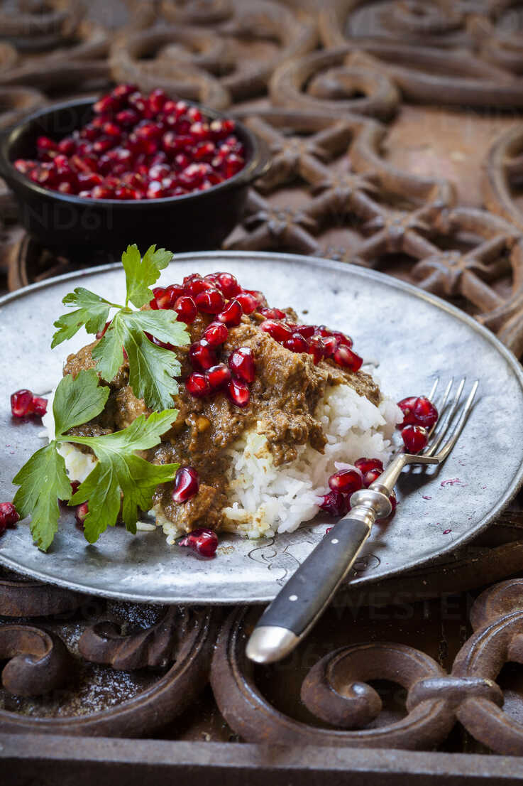 Metal plate of Khoresht Fesenjaan garnished with pomegranate seed stock ...