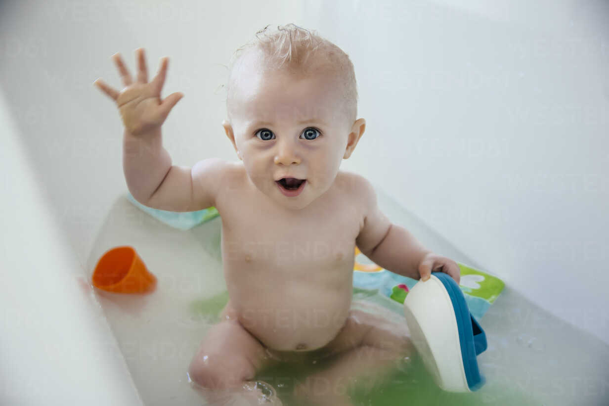 Baby Boy Sitting In A Bathtub Stock Photo, Baby Boy Bathtub