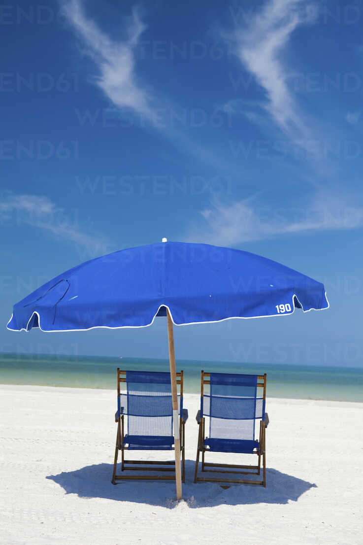 Deckchairs and parasol on Clearwater, United States stock photo