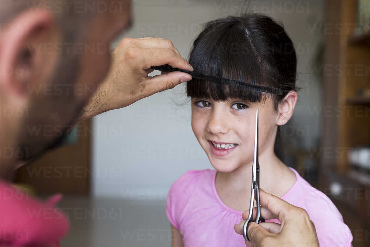 Premium Photo | Father cuts her son hair in the room. family during  quarantine