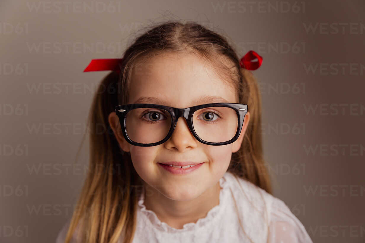 Portrait of little girl wearing oversized glasses stock photo