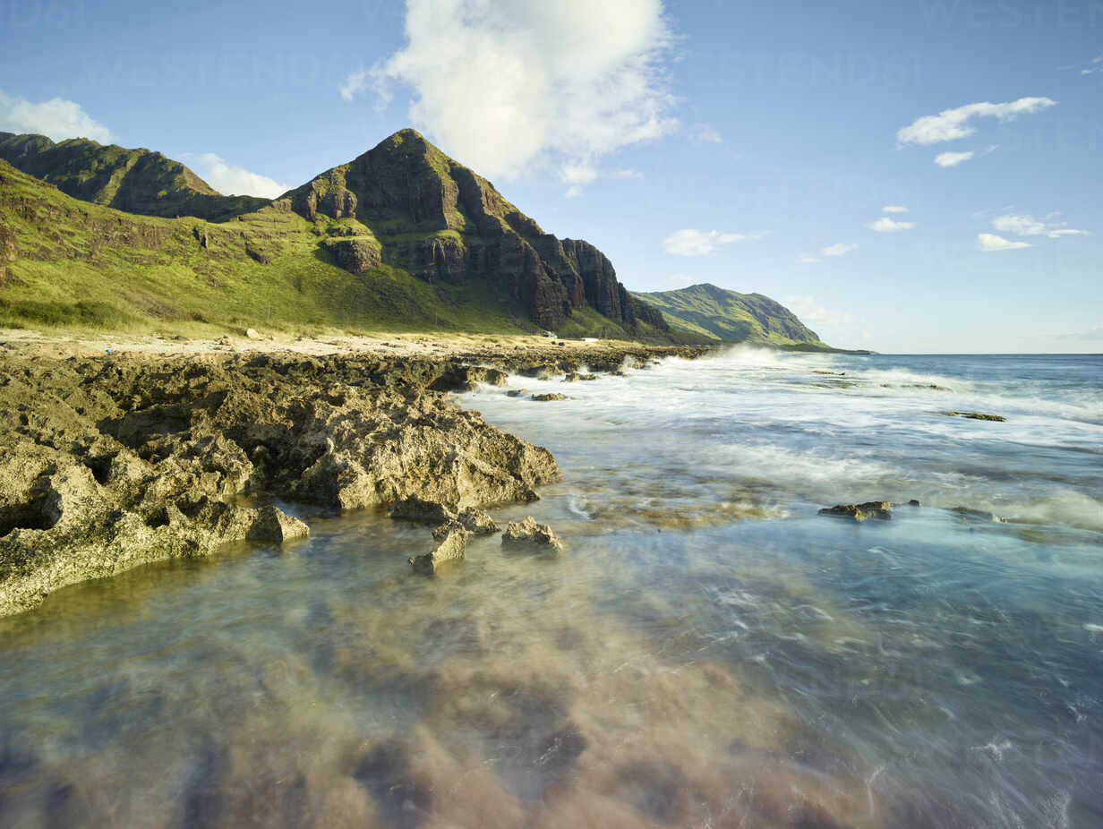 Scenic view of beach in Ka'ena Point State Park against sky stock photo