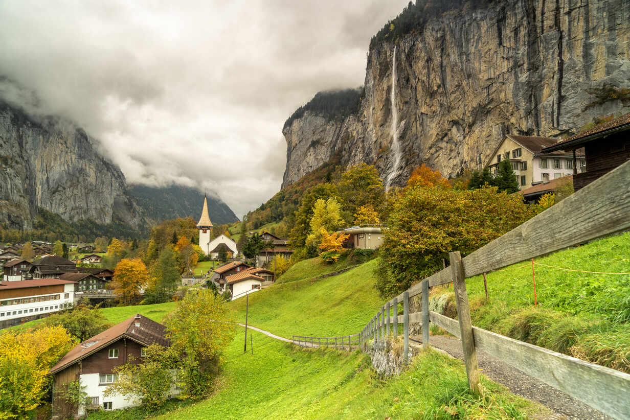 Path in the autumn landscape of Lauterbrunnen village towards Trummelbach Falls, Bern canton, Bernese Oberland, Switzerland,