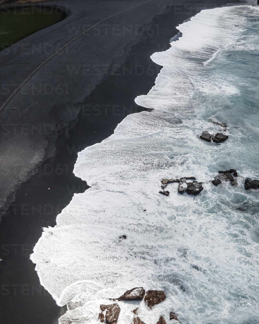 Aerial view of a black sand beach near Lago Verde (Green Lake) in  Lanzarote, Canary Islands,